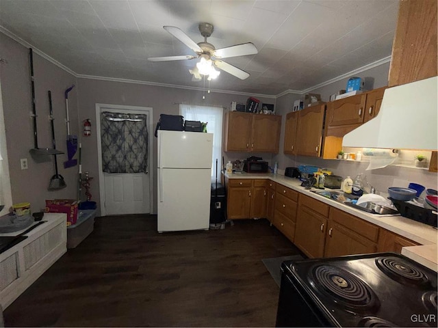 kitchen featuring dark wood-type flooring, ornamental molding, white fridge, and electric range