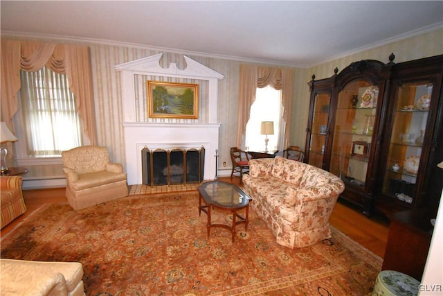 sitting room featuring a wealth of natural light, crown molding, hardwood / wood-style flooring, and a baseboard radiator