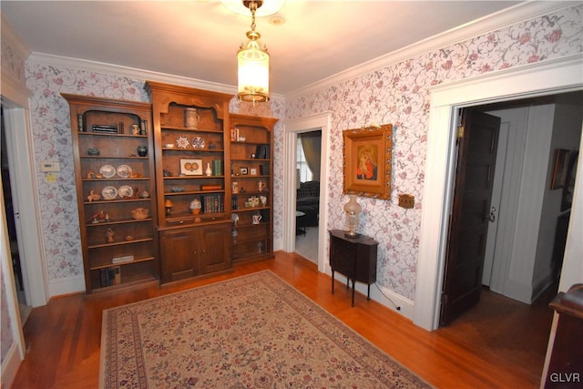 interior space featuring crown molding and dark hardwood / wood-style floors