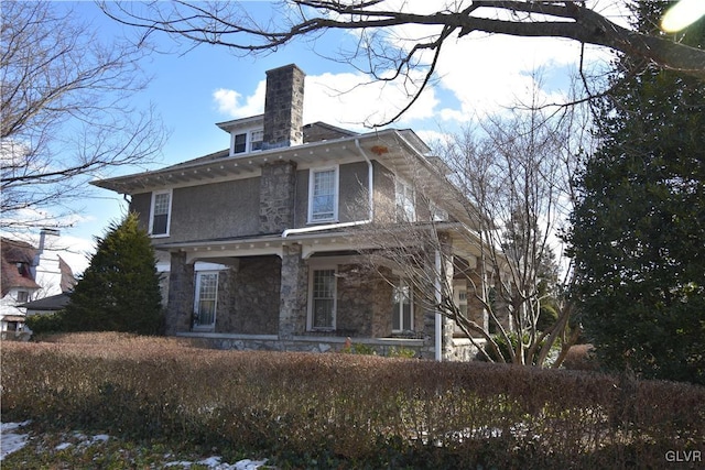 rear view of house featuring a porch