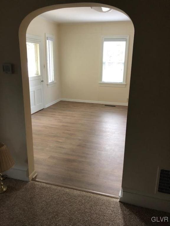 spare room featuring hardwood / wood-style floors