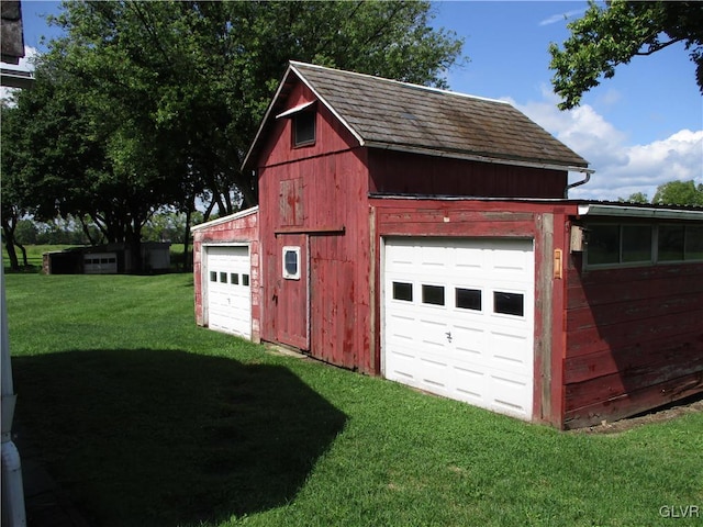 garage with a yard