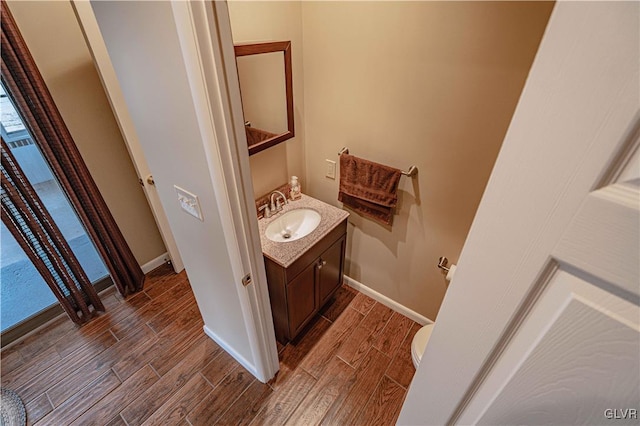 bathroom with toilet and vanity