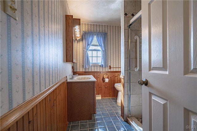 bathroom with vanity, tile patterned flooring, toilet, and a shower with shower door