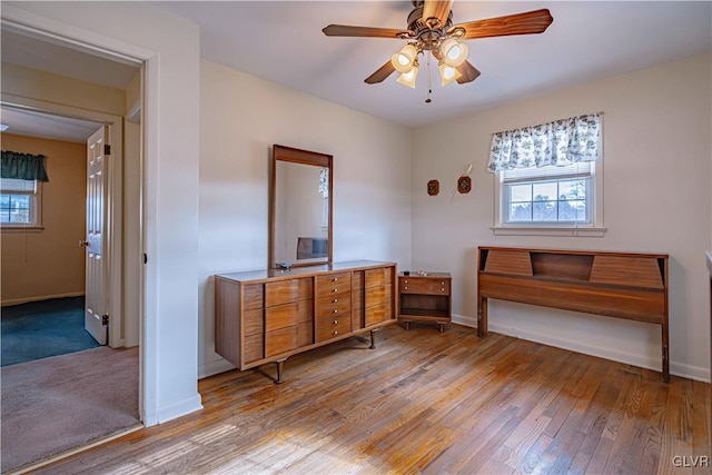 bedroom featuring light hardwood / wood-style floors and multiple windows