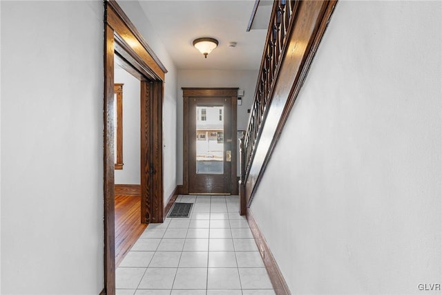 corridor with light tile patterned floors