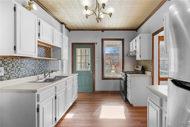 kitchen featuring white cabinetry, appliances with stainless steel finishes, and sink