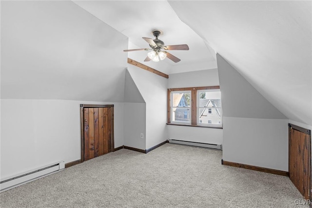 additional living space with light carpet, vaulted ceiling, ceiling fan, and baseboard heating