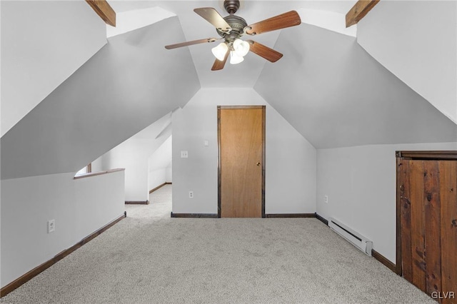 bonus room featuring light carpet, vaulted ceiling, ceiling fan, and a baseboard radiator