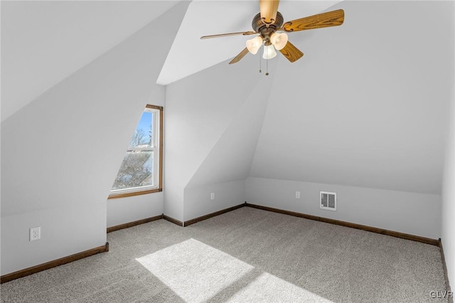 bonus room featuring light carpet, vaulted ceiling, and ceiling fan