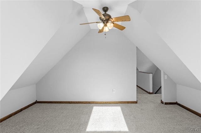 additional living space featuring lofted ceiling, light colored carpet, and ceiling fan