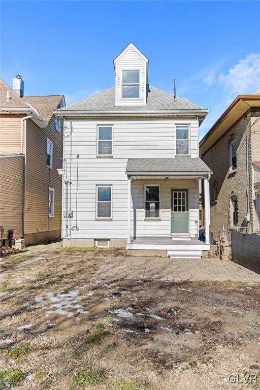 rear view of house with a porch