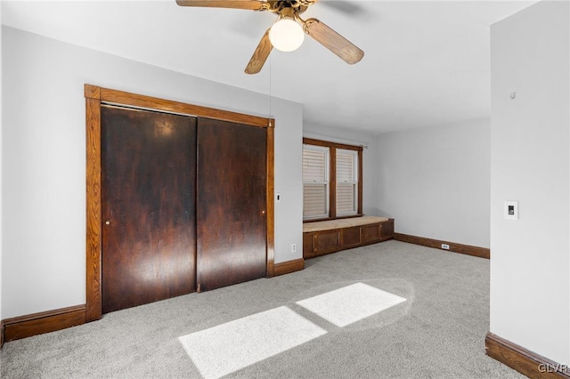 unfurnished bedroom featuring a closet, ceiling fan, and carpet flooring