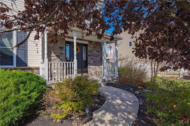 doorway to property with covered porch