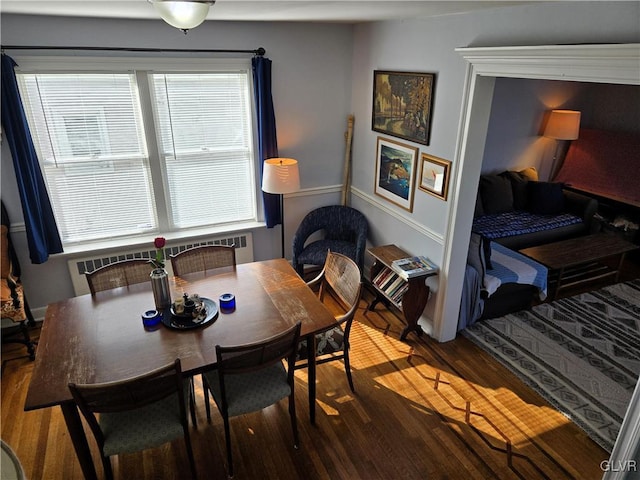 dining room with hardwood / wood-style floors