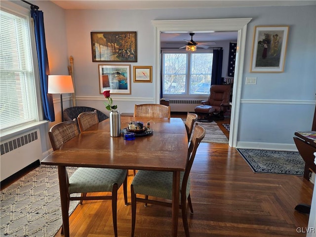 dining room with radiator and parquet flooring