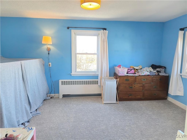 carpeted bedroom with radiator