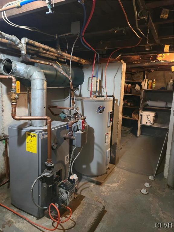 utility room featuring electric water heater