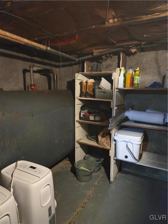 storage area with separate washer and dryer