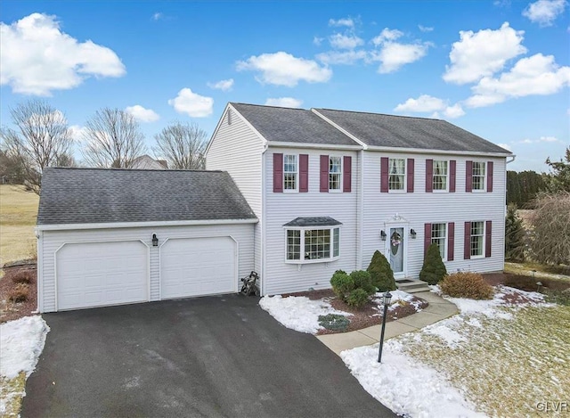 colonial-style house featuring a garage