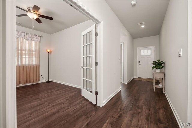 interior space with dark wood-style floors and baseboards