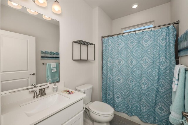 bathroom with toilet, tile patterned floors, a shower with shower curtain, and vanity