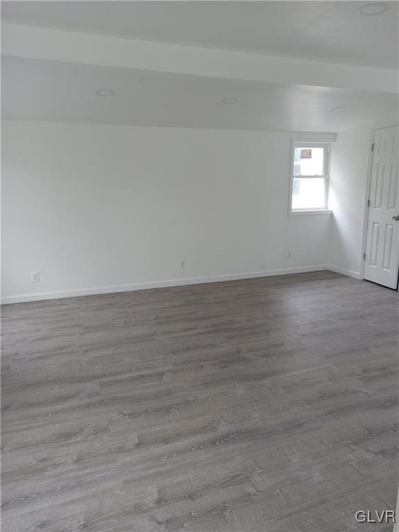 unfurnished room with light wood-type flooring