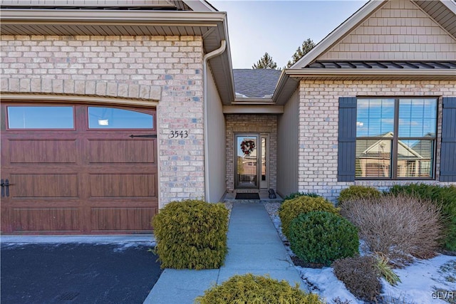 doorway to property featuring a garage