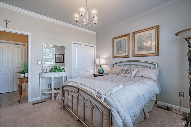 bedroom featuring a closet, a chandelier, crown molding, and light colored carpet