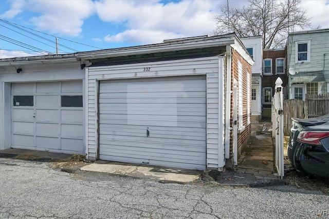 garage featuring fence