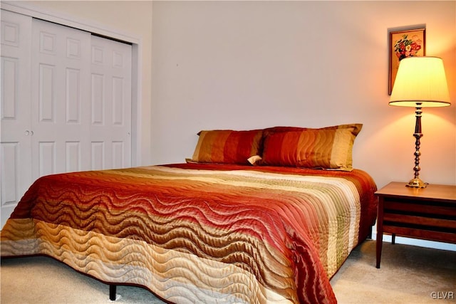 carpeted bedroom with a closet