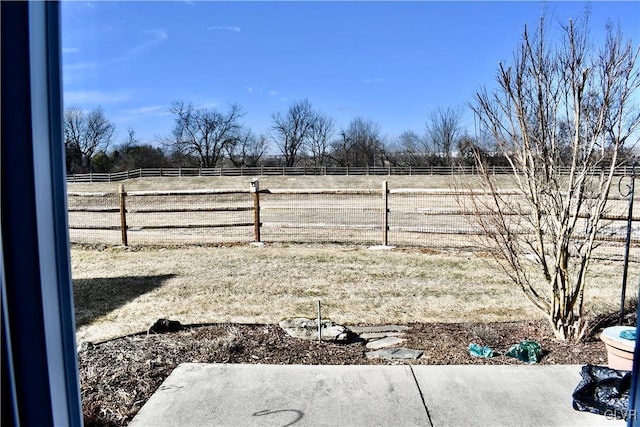 view of yard with a rural view