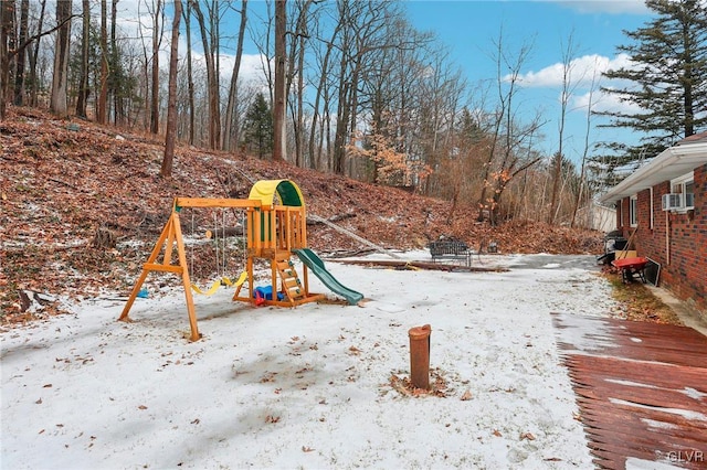 snow covered playground featuring cooling unit