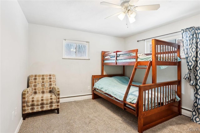 carpeted bedroom featuring ceiling fan and a baseboard radiator