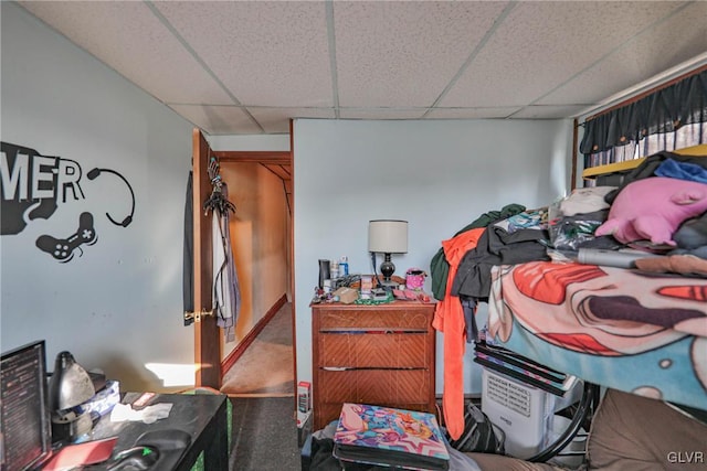 carpeted bedroom with a paneled ceiling