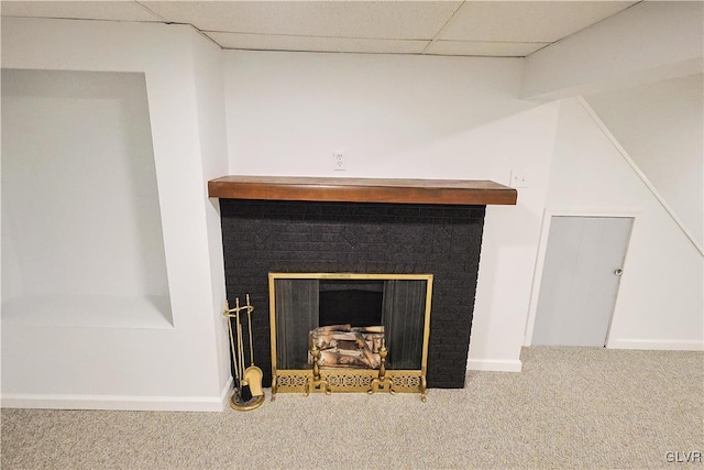 room details featuring a paneled ceiling and carpet flooring