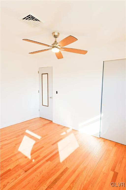 spare room featuring hardwood / wood-style flooring and ceiling fan