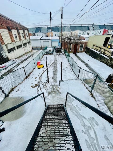 view of yard layered in snow