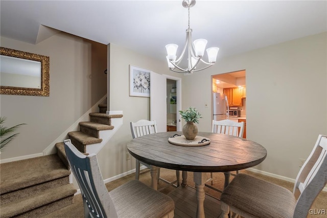 dining room with a notable chandelier