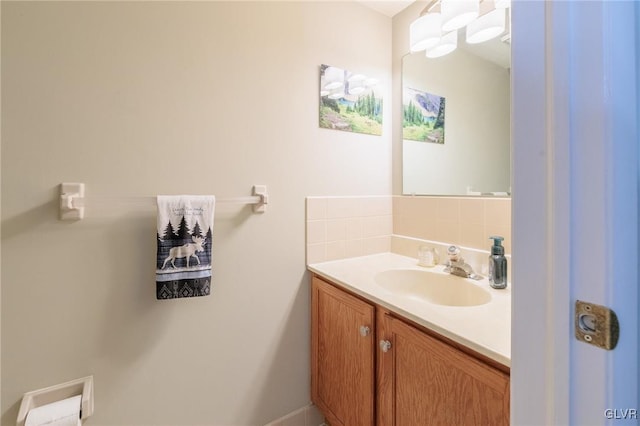 bathroom with vanity and decorative backsplash