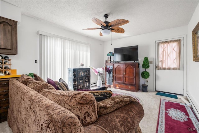 living room with light carpet, ceiling fan, and a textured ceiling