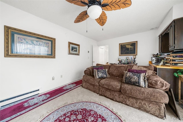 living area with ceiling fan, carpet, a baseboard radiator, and a toaster