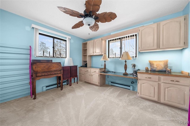 office with light carpet, a baseboard radiator, and a ceiling fan