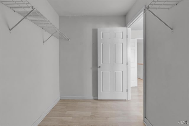 spacious closet featuring light wood-type flooring