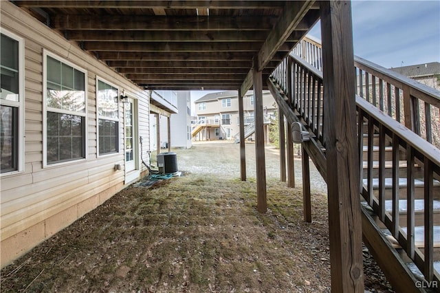 exterior space with central AC and stairway