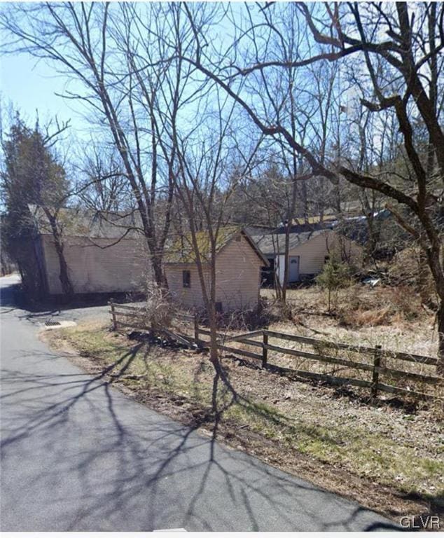 view of front of property featuring fence