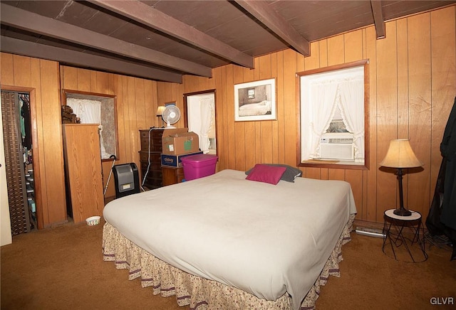 bedroom featuring carpet, beam ceiling, and wood walls