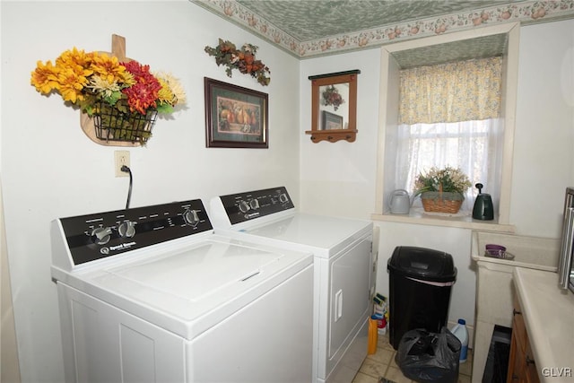 washroom featuring laundry area and washing machine and clothes dryer