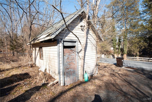 view of side of property featuring fence