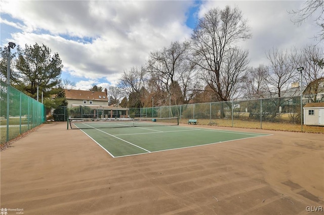 view of tennis court with fence